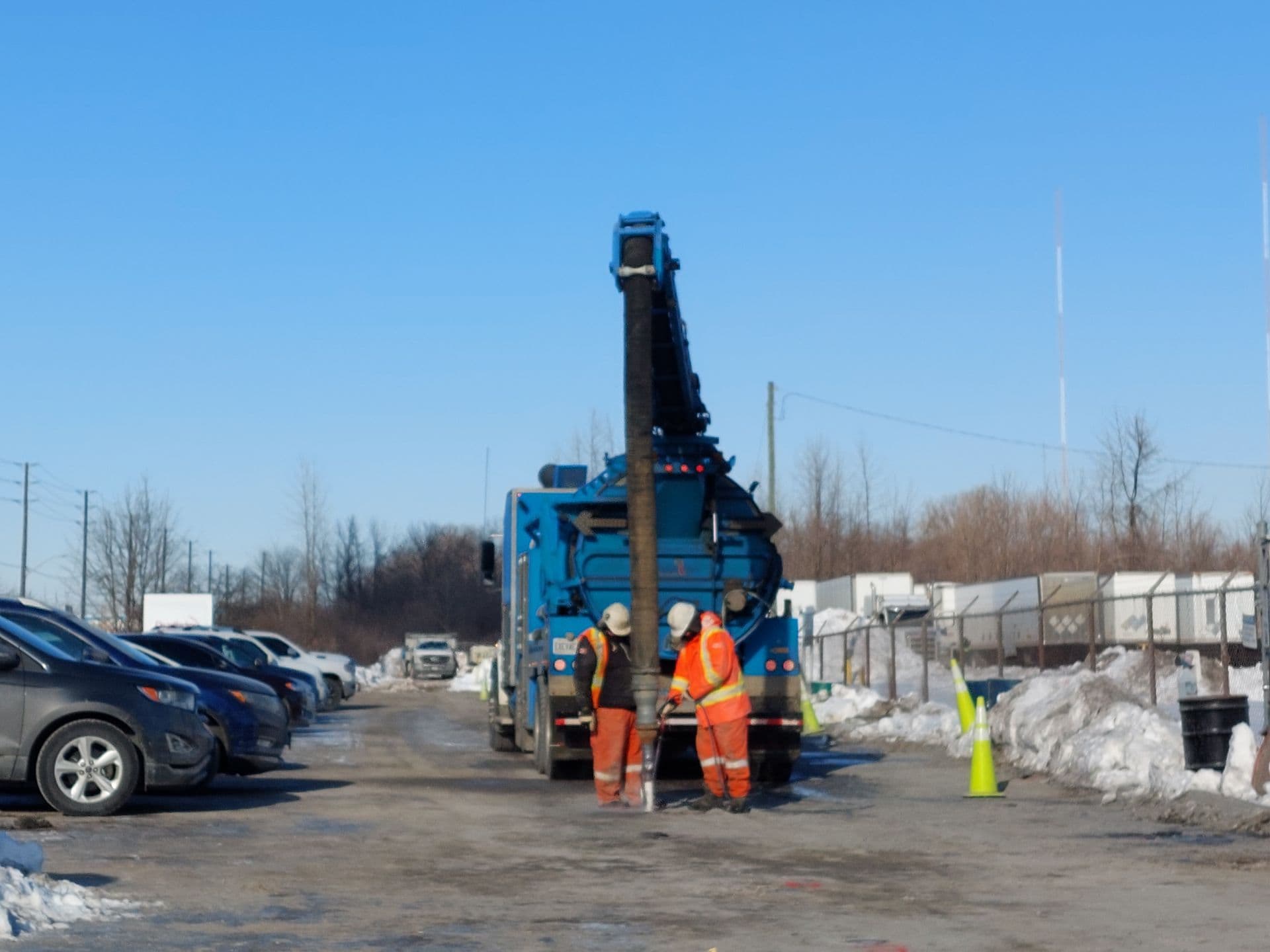 Surfactant flushing happening on site with two VEI crew members.